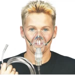 Oxygen mask with nebulizer chamber and oxygen tube